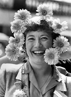 Woman wearing a headdress made of flowers. April 1980 P007842 Woman wearing a headdress made of flowers. April 1980 P007842