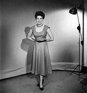 Woman wearing a pinafore dress November 1952 C6272-002 Woman wearing a pinafore dress November 1952 C6272-002