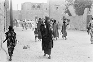 Women carrying pots to market in Timbuktu 23rd May 1976 Women carrying pots to market in Timbuktu 23rd May 1976