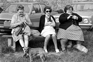 Images Dated 27th April 1975: Three women with larger figures seen here knitting whilst their children play in a poorer