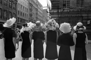 Women modelling hats for the 1966 Royal Ascot festiva - back view of the floral hatsl Women modelling hats for the 1966 Royal Ascot festiva - back view of the floral hatsl