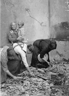 Women vainly seeking for belongings amid the ruins of their homes at Melle which were Women vainly seeking for belongings amid the ruins of their homes at Melle which were