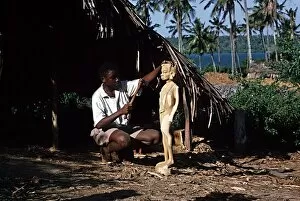 Woodcarver working on statue Mombasa Kenya Africa