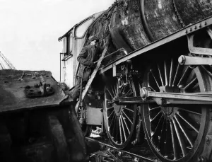 A workman cutting up an old engine at a breakers yard at North Blyth on 5th January 1965 A workman cutting up an old engine at a breakers yard at North Blyth on 5th January 1965