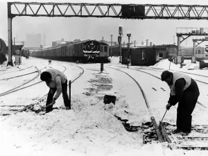 Workmen use gas heaters to free the points at Cardiff Station Workmen use gas heaters to free the points at Cardiff Station