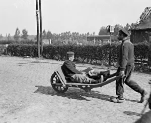 A wounded Belgian soldier is wheeled away from the battlefield close to the town of A wounded Belgian soldier is wheeled away from the battlefield close to the town of