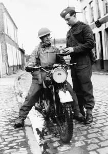 WW2 A dispatch rider from the Hampshire Regiment receives a message from headquarters WW2 A dispatch rider from the Hampshire Regiment receives a message from headquarters