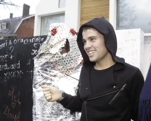 X factor contestant Joe McElderry greets a fan outside the finalists house X factor contestant Joe McElderry greets a fan outside the finalists house
