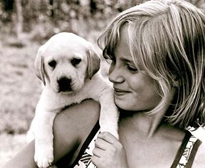 Images Dated 14th September 1977: Ten year old Amanda Littlechild holds a puppy in her hands at her home in Kent
