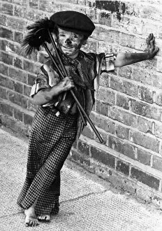 Four year old chimney sweep Tommy Stafford in fancy dress to celebrate the 100th