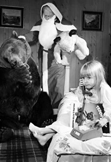 Images Dated 9th December 1980: Four year old Gayl Mather chats to Santa Claus about her adventures with Hercules