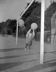 Ten year old George Welch makes a flying save while in goal for his school football team Ten year old George Welch makes a flying save while in goal for his school football team