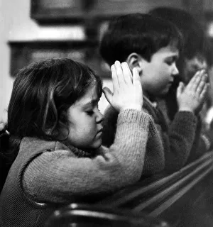 Five year old Jane Curtis praying with her school friends that their village, Stewkley Five year old Jane Curtis praying with her school friends that their village, Stewkley