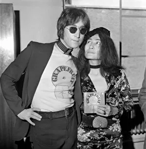 Images Dated 15th July 1971: Yoko Ono launches new book: John Lennon signing copies of Grapefruit'