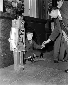 A young boy with a robot guy. 8th October 1957 A young boy with a robot guy. 8th October 1957