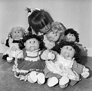 Images Dated 5th November 1987: A young girl plays with her Cabbage Patch Dolls. 5th November 1987