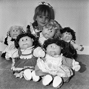 Images Dated 5th November 1987: A young girl plays with her Cabbage Patch Dolls. 5th November 1987