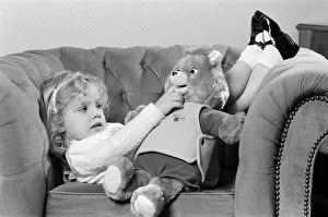 Images Dated 21st October 1986: A young girl with a Teddy Ruxpin toy. 21st October 1986
