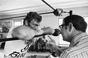 Images Dated 27th June 1970: A young Joe Bugner (left) with boxing trainer Angelo Dundee in a New York gym