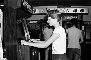 Images Dated 13th July 1983: Young people playing video games in an amusement arcade in London. 13th July 1983