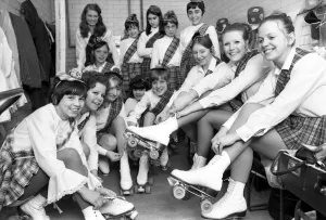 Images Dated 4th April 1970: Young roller skaters lace up their boots and chat back stage as they prepare to take part