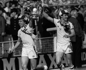 Young seventeen years old Paul Allen (right) leads the way with the FA Cup after West Ham Young seventeen years old Paul Allen (right) leads the way with the FA Cup after West Ham