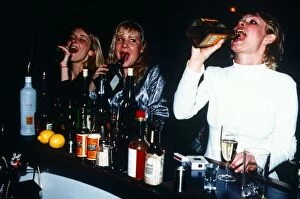 Images Dated 24th January 1996: Young Women drinking straight from the bottle in a Bar - January 1996 Girls