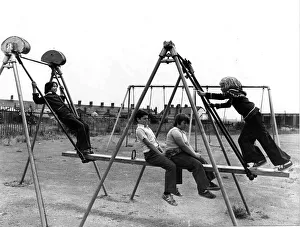 Four youngsters enjoying the Summer sunshine at a play area in the Cardiff docks area Four youngsters enjoying the Summer sunshine at a play area in the Cardiff docks area