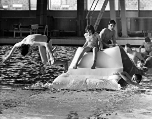 Youngsters tackle the inflatable assault course at Stanley Baths. 8th March 1986 Youngsters tackle the inflatable assault course at Stanley Baths. 8th March 1986