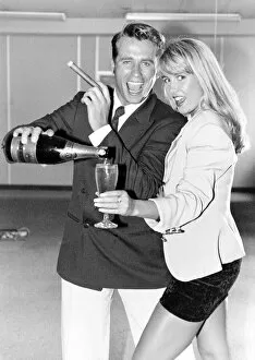 Images Dated 6th October 1992: Yuppie couple drinking champagne and smoking cigars
