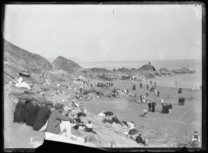 East Looe Beach with people in their Sunday best East Looe Beach with people in their Sunday best