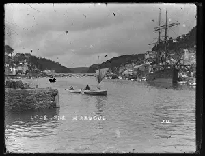 Looe Harbour with masted ship at Granite Quay Looe Harbour with masted ship at Granite Quay