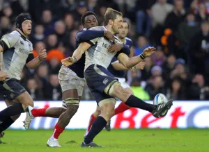 Fulgence Ouedraogo Challenges John Barclay As He Kicks Scotland V France Scotland V France, Rbs 6 Nations Murrayfield, Edinburgh, Scotland 07 February 2010 Date: 07 February 2010 Fulgence Ouedraogo Challenges John Barclay As He Kicks