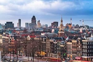Netherlands Collection: Amsterdam, Netherlands historic cityscape with the modern Zuidas district in the distance at dusk
