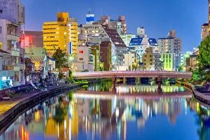 Images Dated 15th April 2014: Wakayama City, Japan cityscape on the Waka River at night.