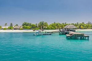 Images Dated 5th January 2017: Wooden pier and jetty with seaplane at tropical island resort, Maldives. Luxury summer travel