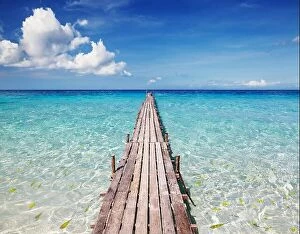 Images Dated 8th December 2009: Wooden pier on a tropical island, clear sea and blue sky
