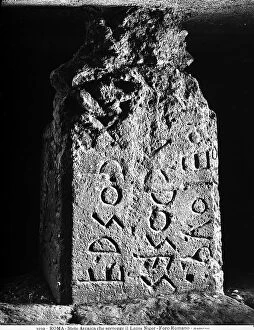 Related Images Collection: Ancient stele that holds up the Lapis Niger located in the Roman Forum in Rome