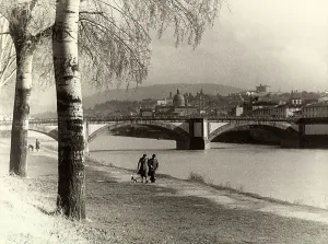 Prints of Couple walking along the Arno at the Cascine, on the background Ponte alla Vittoria in Florence Florence Cascine garden. Date of Photograph:1935-1940 ca Florence Prints: Couple walking along the Arno at the Cascine