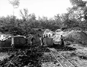 Images Dated 14th April 2014: Group of miners shown outside the Moriani di Follonica mine, while pushing a cart on rails