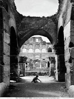 Images Dated 9th September 2010: A little boy playing on the ruins of the northern podium of the Colosseum, in Rome