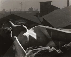 Images Dated 5th August 2011: Lying naked women having on her body an overlay of roof of an industrial city