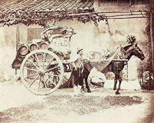 Images Dated 27th June 2012: A man posing next to a wagon wine