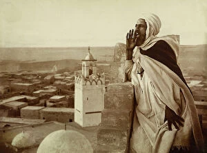 Related Images Collection: Muezzin recites a prayer from a minaret