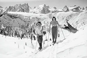 Portrait of a couple on the skis in a snowy mountain landscape, Cortina d'Ampezzo
