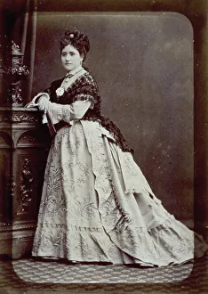 Portrait of an elegantly dressed young woman in the late 19th century