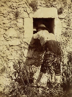 Images Dated 8th June 2012: Portrait from the back of a man in traditional costume leaning on the sill of a window of a farm