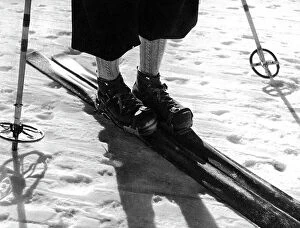 Images Dated 12th March 2010: Ski, ski-sticks, skiing-boot and legs of a skier, 1930s