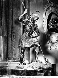 St. George killing the dragon with a lance. Sculpture located in the Cathedral of Ferrara