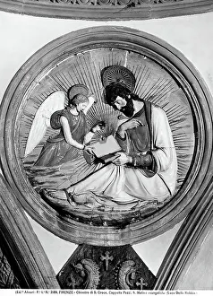 St. Matthew of the Evangelist. Glazed terracotta by Luca della Robbia. Decoration of Cappella Pazzi in Santa Croce in Florence